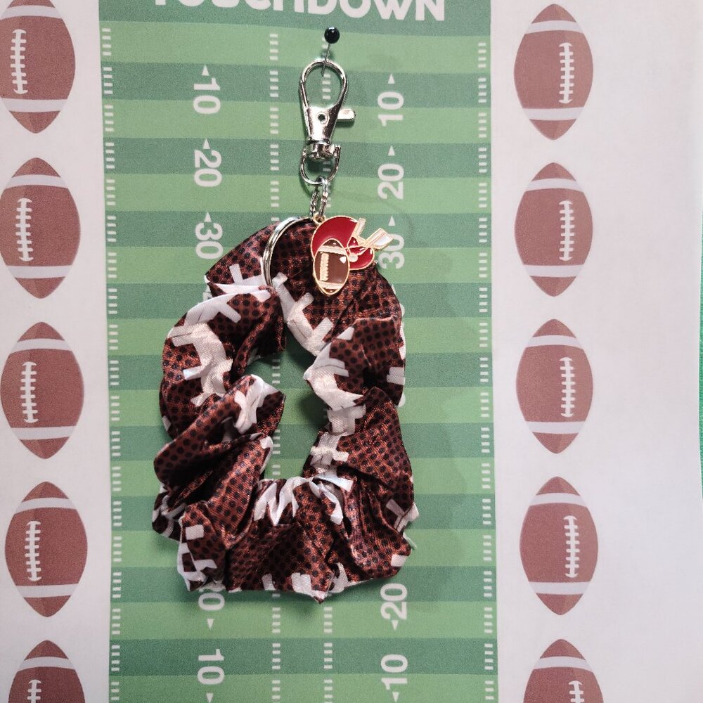 Football Themed Wristlet Keyring with a Football related charm attached !!
